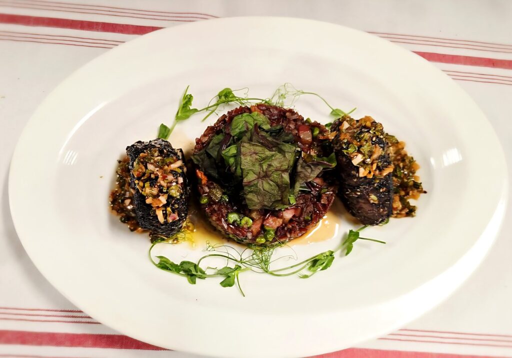 Grilled lamb chops with chimichurri, black rice and pea shoots, plated by a Denver private chef
