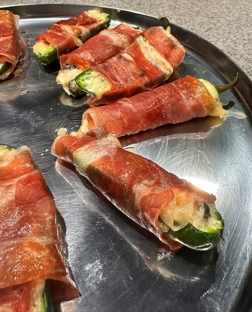Prosciutto-wrapped stuffed jalapeños, a passed appetizer for private events