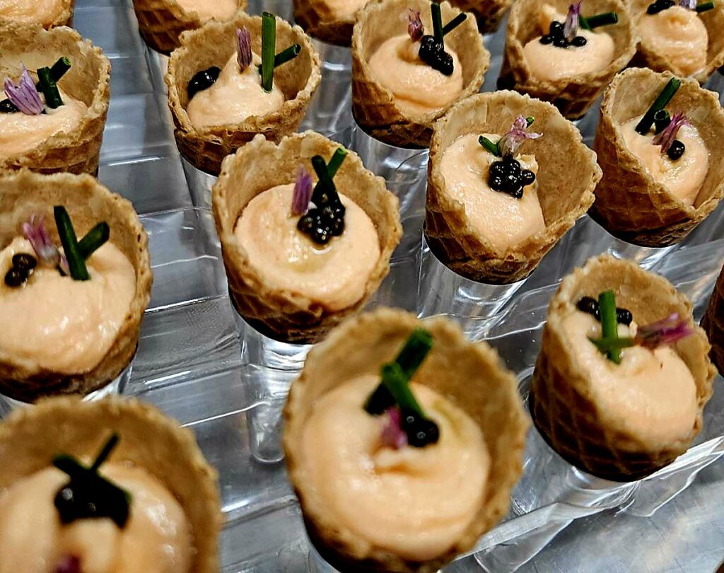 Savory cones filled with salmon mousse, caviar and chive, passed at a Colorado event
